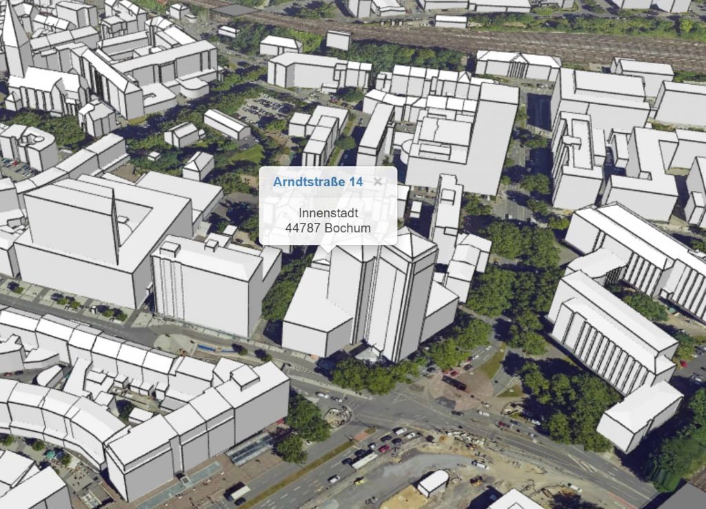 Digitales Stadtmodell mit Gebäuden und Markierungen.